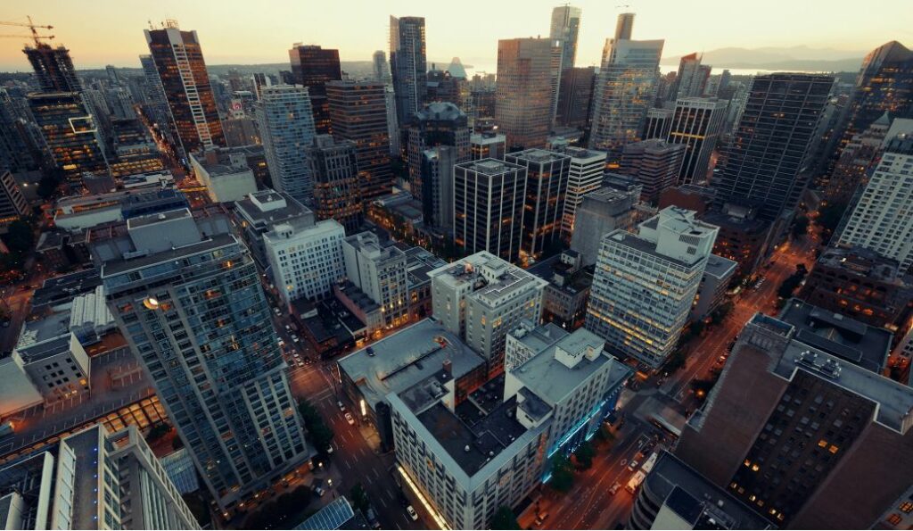 Aerial view of downtown buildings representing businesses needing employee time tracking solutions