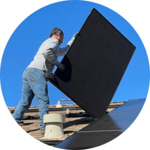 Solar technician installing panel while using VeriClock for field time tracking and safety reporting.